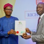 Mr. Kayode Lawal, Managing Director/CEO of Polaris Bank, receiving on behalf of the bank, Premium Membership Certificate into Nigerian-British Chamber of Commerce (NBCC) from Mr. Kayode Falowo, NBCC’s Ex-President/Chairman, Greenwich Merchant Bank in Lagos recently.