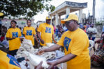 Mrs. Rosemary Osaro sharing food items