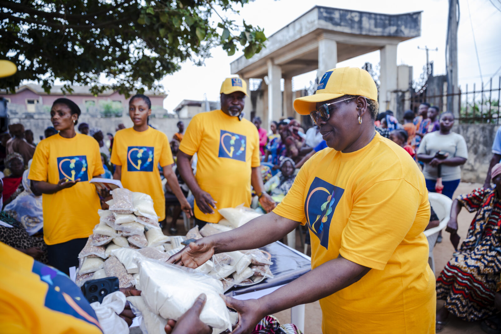 Mrs. Rosemary Osaro sharing food items