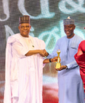 Vice President Kashim Shettima presenting an award to Dr Aminu Maida, Executive Vice Chairman/CEO of the Nigerian Communications Commission (NCC) after the Commission was named one of the top five best-performing Federal Government agencies for 2025 under the Transparency and Efficiency Category of Presidential Enabling Business Environment Council (PEBEC) award.