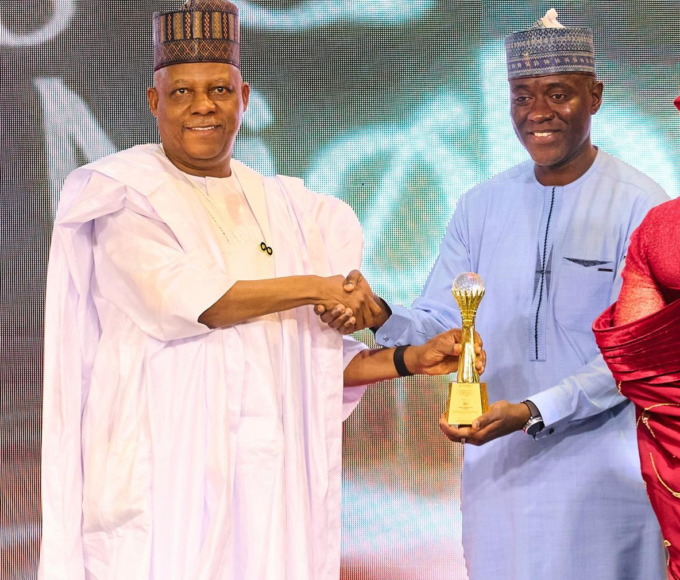 Vice President Kashim Shettima presenting an award to Dr Aminu Maida, Executive Vice Chairman/CEO of the Nigerian Communications Commission (NCC) after the Commission was named one of the top five best-performing Federal Government agencies for 2025 under the Transparency and Efficiency Category of Presidential Enabling Business Environment Council (PEBEC) award.