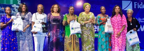 Mrs. Pamela Shodipo, Executive Director, South, Fidelity Bank Plc (2nd L); Mrs. Amaka Onwughalu, Chairman, Board of Directors, Fidelity Bank Plc (4th L); Dr. Nneka Onyeali-Ikpe, MD/CEO, Fidelity Bank Plc (6th L); and Dr (Mrs.) Nonye Soludo, First Lady of Anambra State (2nd R), with the beneficiaries at the Fidelity Bank Empowerment Programme organized in partnership with Healthy Living with Nonye Soludo Foundation, held in Awka, Anambra State recently.